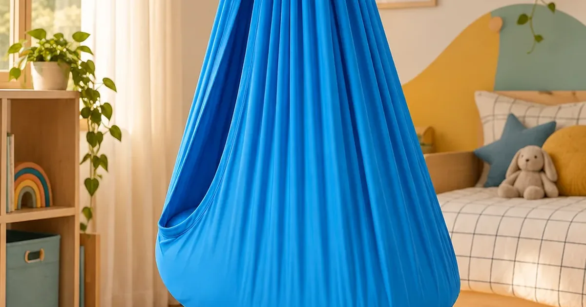A blue CIPPO Sensory Swing hanging in a warmly lit child's bedroom